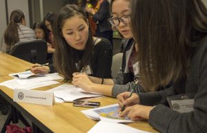 Visiting Mongolian students worked to resolve an international HIV/AIDS crisis in the imaginary countries of Daymar and Lateen during a diplomacy in Action simulation at the Arlington Campus. Photo courtesy of Chris Preperato.